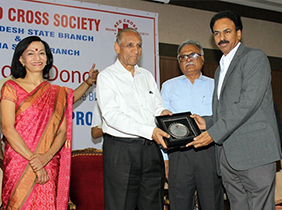 Receiving Award from the Hon’ble Governor of  Telangana and (AP) – Mr ESL Narasimhan garu for being part of CSR Activities.